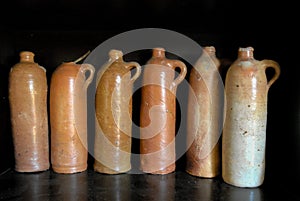 Set of old ceramic bottles used for burning water