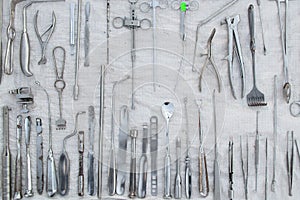 Set of old medical instruments clamps ,scalpels and scissors on a white background