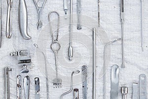 Set of old medical instruments clamps ,scalpels and scissors on a white background