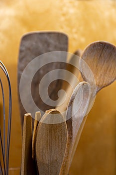 Set of old rustic wooden kitchen utensils and salad servers