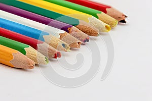 Set of old used and broken colored pencils on a white background. Ugly worn crayons or pencils with broken ends should be