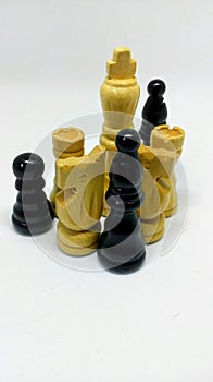 Set of old wooden black and white chess board game pieces