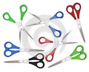 A set of open and closed colorful scissors on a white background