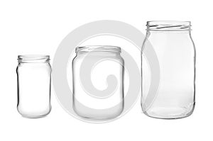 Set with open empty glass jars on background
