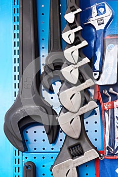 Set of open-end and adjustable wrenches on stand