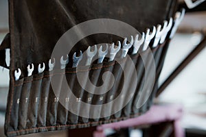 Set of open-end wrenches in a black case. Open-end wrenches close-up photo