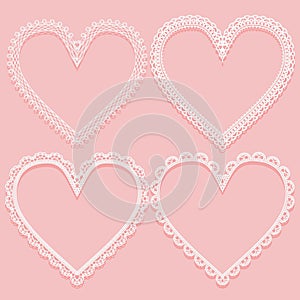 Set of openwork white frames in the shape of lace hearts. Design elements on pink background