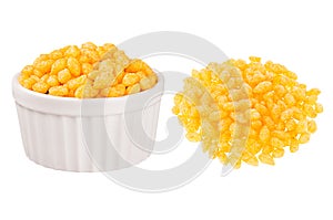 Set of orange chili corn sticks as heap and in ceramics bowl isolated on white background.