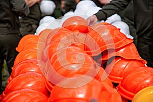 Set orange deferential helmet, construction tools for industrial safety. Set of protective hardhats. Onstruction helmets