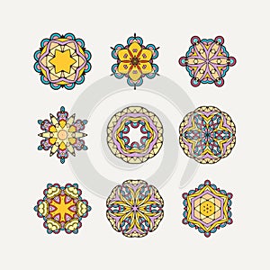 Set of ornate vector mandala symbols. Mehndi lace tattoo. Oriental weave with sharp corners.