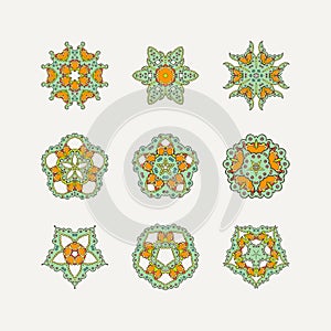 Set of ornate vector mandala symbols. Mehndi lace tattoo. Oriental weave with sharp corners.