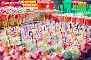 Set packed of fresh fruits and juices in La Boqueria market, in