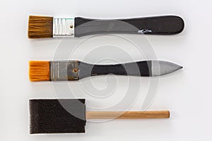 Set of paint brushes made from synthetics hairs and sponge on white background
