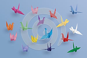 Set of paper birds on blue background.the art of origami