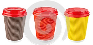 Set of paper disposable cups of different colors for coffee, tea and other hot drinks isolated in white. Disposable tableware