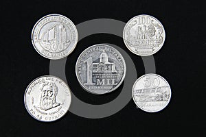 Set of paraguayan coins in a row isolated on black background