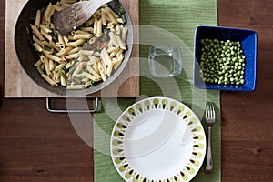 Set of pasta with flowers of zucchini and fresh green pea