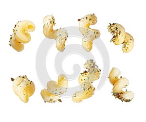 Set of pasta sprinkled with dry herbs close-up isolated on a white background