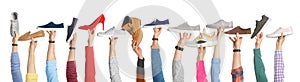 Set of people holding different stylish shoes on white background