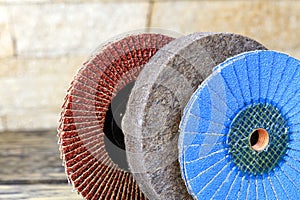 Set of petal circlesfor grinding from different grains and a felt circle on a light beige background in unsharpness photo