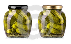 Set of Pickled cucumbers in glass jars on a white background with clipping path