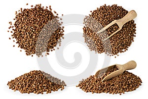 Set of pile buckwheat with wooden spoon and without on a white, isolated.