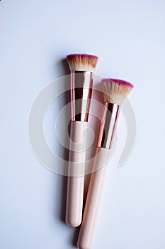 Set of pink and gold makeup brushes professional kit