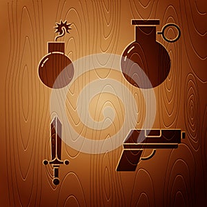 Set Pistol or gun, Bomb ready to explode, Medieval sword and Hand grenade on wooden background. Vector