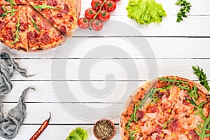 Set pizza. Italian cuisine. Top view. On a wooden background.