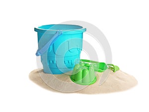 Set of plastic beach toys and pile of sand on white