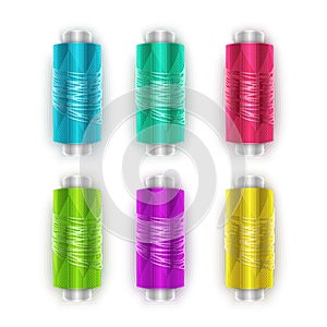 Set of plastic bobbins, spools with colored thread isolated on background. Equipment for sewing, tailoring, accessory for