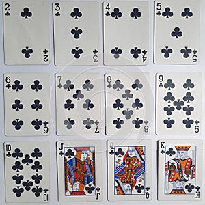 A set of playing cards featuring four distinct designs, perfect for a game of cards.