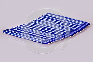 Blue plastic pens isolated on white