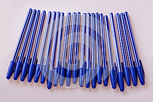 Blue plastic pens isolated on white