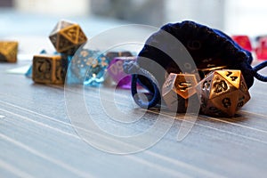 A set of polyhedral dice with a draw string bag photo