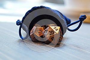 A set of polyhedral dice with a draw string bag photo