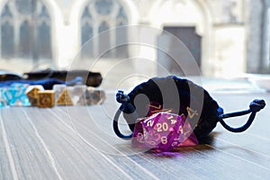 A set of polyhedral dice with a draw string bag photo