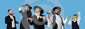 Set of portraits of mixed aged men, orthodox jewish men with wooden grager ratchet during festival Purim. Holiday