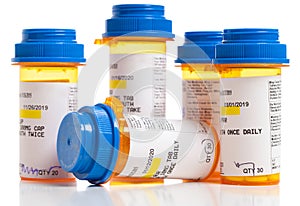 Set of prescriptions. Brown bottles and blue plastic caps on a white background