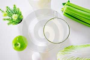 set of products for healthy eating white and green layout on the kitchen table.