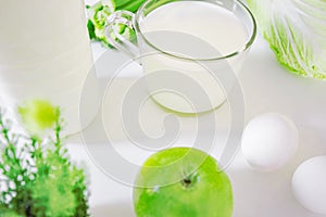 set of products for healthy eating white and green layout on the kitchen table.