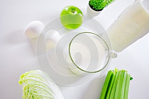 Set of products for healthy eating white and green layout on the kitchen table