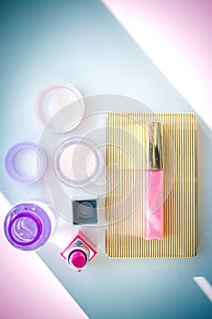 Set of professional decorative cosmetics, makeup tools and accessory on multicolored background. beauty, fashion, party