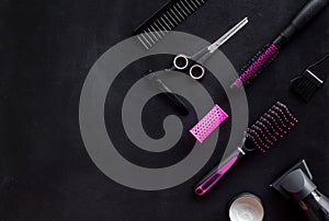 Set of professional hairdresser tools with combs, sciccors and styling on black background top view mock up