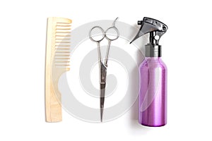 Set of professional hairdresser tools equipment on white background - scissors, comb and spray - hair stylist concept