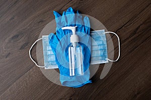 Set of protective eqipment agains corona covid viruses - chirurgical mask, gloves, glasses and bottle with alcohol gel or liquid