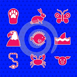 Set Puffer fish, Crab, Pig, Shark fin in ocean wave, Worm, Eagle head, Butterfly and Paw print icon. Vector