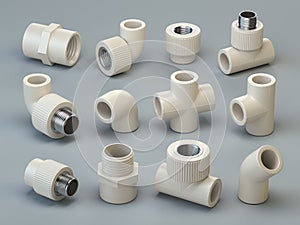 Set of PVC pipe fittings on grey background