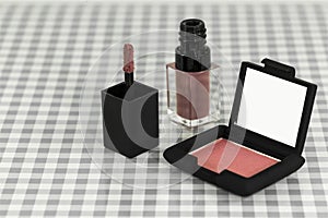 Set of Radiant Creamy Concealer cosmetics. Makeup tools on table cloths background
