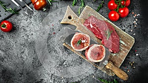 Set Raw beef steak on a dark table. beef rump steak, Tenderloin fillet mignon for grilling. Long banner format, top view